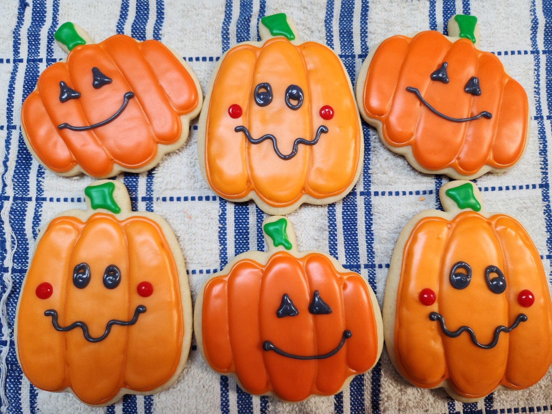 Halloween pumpkin and ghost decorated cookies